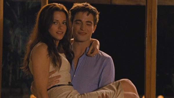 Edward Cullen (Robert Pattinson) carried his new bride Bella Swan (Kristen Stewart) over the threshold as they begin their honeymoon in this scene from The Twilight Saga: Breaking Dawn - Part 1. - Provided courtesy of OTRC / Summit Entertainment Edward Cullen (Robert Pattinson) carried his new bride Bella Swan (Kristen Stewart) over the threshold as they begin their honeymoon in this scene from The Twilight Saga: Breaking Dawn - Part 1. - Provided courtesy of OTRC / Summit Entertainment