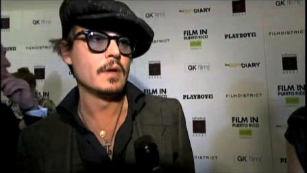 Johnny Depp talks to reporters at the premiere of The Rum Diary.