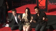Watch the Twilight stars get their hand and footprints immortalized at Graumans Chinese Theatre.