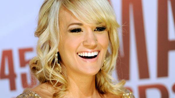 Carrie Underwood arrives at the 45th Annual CMA Awards in Nashville on Wednesday, Nov. 9, 2011. - Provided courtesy of AP / Evan Agostini Carrie Underwood arrives at the 45th Annual CMA Awards in Nashville on Wednesday, Nov. 9, 2011. - Provided courtesy of AP / Evan Agostini