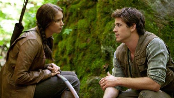 Jennifer Lawrence and Liam Hemsworth appears in a scene from The Hunger Games. - Provided courtesy of Lionsgate Jennifer Lawrence and Liam Hemsworth appears in a scene from The Hunger Games. - Provided courtesy of Lionsgate