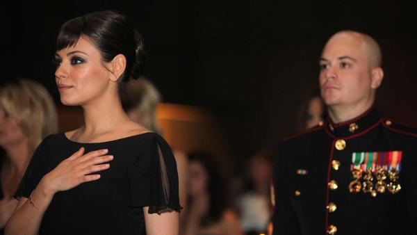 Sgt. Scott Moore and his guest, actress Mila Kunis stand during the National Anthem at the 236th Marine Corps birthday ball for 3rd Battalion, 2nd Marine Regiment, 2nd Marine Division in Greenville, N.C., Nov. 18, 2011. - Provided courtesy of Photo by Cpl. Johnny Merkley Sgt. Scott Moore and his guest, actress Mila Kunis stand during the National Anthem at the 236th Marine Corps birthday ball for 3rd Battalion, 2nd Marine Regiment, 2nd Marine Division in Greenville, N.C., Nov. 18, 2011. - Provided courtesy of Photo by Cpl. Johnny Merkley