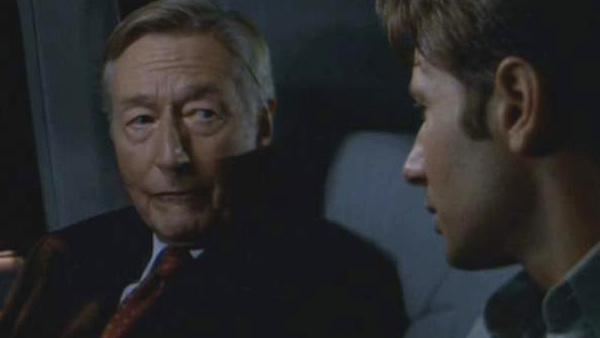 John Neville appears alongside David Duchovny in a scene from the 1998 film 'The X-Files.'