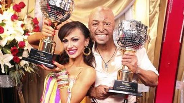 'All My Children' actor and Iraq War veteran J.R. Martinez and his partner Karina Smirnoff hold up their Mirrorball Trophies after winning season 13 of 'Dancing With The Stars' on Tuesday, Nov. 22, 2011.