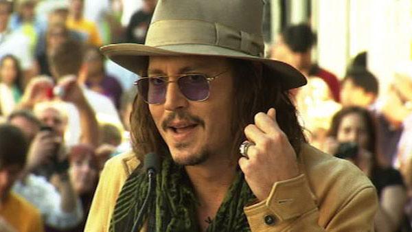 Johnny Depp gives a speech honoring Penelope Cruz before she receives a star on the Hollywood Walk of Fame on April 1, 2011.