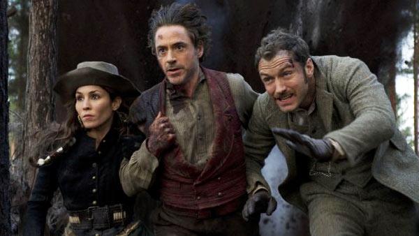 Jude Law, Robert Downey Jr. and Noomi Rapace appear in a still from Sherlock Holmes: A Game of Shadows. - Provided courtesy of Warner Bros. Entertainment / Daniel Smith Jude Law, Robert Downey Jr. and Noomi Rapace appear in a still from Sherlock Holmes: A Game of Shadows. - Provided courtesy of Warner Bros. Entertainment / Daniel Smith