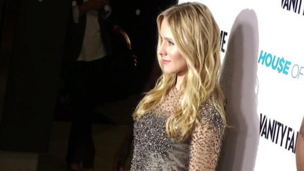 Kristen Bell poses for photos at the premiere of the Showtime series 'House of Lies' in Los Angeles on Jan. 4, 2012.