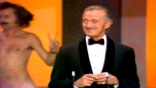 David Nevin is interupted at the 46th Academy Awards in 1974 by a streaking Robert Opel.