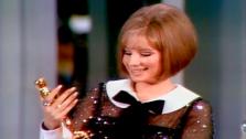Barbra Streisand accepts a Best Actress Oscar for Funny Girl.