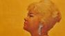 Etta James appears on the cover of her debut studio album 'At Last,' which was released in 1961.