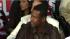 Chris Tucker watches performers on stage at...
