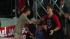 Justin Bieber (left) shakes the hand of an...