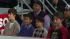 Justin Bieber (left) watches performers on stage...