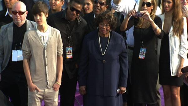 Justin Bieber and Michael Jackson's mother Katherine watch as the late singer's children Prince, Blanket and Paris place their hands in cement at a ceremony at the Grauman's Chinese Theatre on Jan. 26, 2012.