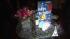 A card and balloons are displayed on a table at...