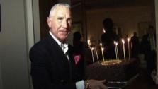 Frederic Prinz von Anhalt carries a chocolate birthday cake made by Wolfgang Puck at his wife Zsa Zsa Gabors 95th birthday party at their Bel-Air home on Feb. 6, 2012. The ailing actress was kept behind closed doors. - Provided courtesy of OTRC