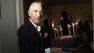 Frederic Prinz von Anhalt carries a chocolate birthday cake made by Wolfgang Puck at his wife Zsa Zsa Gabor's 95th birthday party at their Bel-Air home on Feb. 6, 2012. The ailing actress was kept behind closed doors.