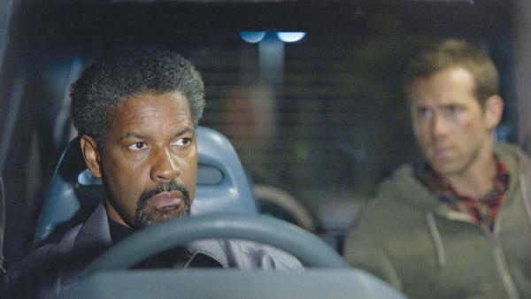 Ryan Reynolds and Denzel Washington appear in a still from Safe House. Ryan Reynolds and Denzel Washington appear in a still from Safe House.