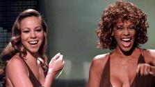 In this Sept. 10, 1998 file photo, Mariah Carey, left, and Whitney Houston present the award for Best Male Video during the MTV Video Music Awards, in Universal City, Calif. - Provided courtesy of AP / Kevork Djansezian