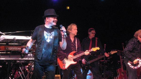 From left: Micky Dolenz, Peter Tork, guest bassist and Davy Jones appear in concert in Westbury, New York on June 17, 2011.