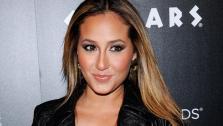 Singer Adrienne Bailon attends Caesars Entertainment Escape to Total Rewards kick-off at Gotham Hall on Thursday, March 1, 2012 in New York. - Provided courtesy of AP / Evan Agostini