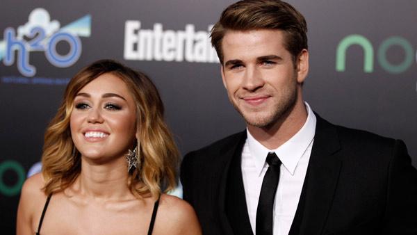 Miley Cyrus, left, and Liam Hemsworth arrive at the world premiere of The Hunger Games on Monday March 12, 2012 in Los Angeles. - Provided courtesy of AP / Matt Sayles Miley Cyrus, left, and Liam Hemsworth arrive at the world premiere of The Hunger Games on Monday March 12, 2012 in Los Angeles. - Provided courtesy of AP / Matt Sayles