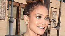 Jennifer Lopez and boyfriend Casper Smart attend the grand opening of restaurant Planet Dailies and lounge Mixology 101 in Los Angeles on April 5, 2012. The event included a screening of the American Idol judges new music video, Dance Again. - Provided courtesy of Christopher Polk / Getty Images