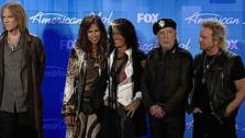 American Idol judge Steven Tyler stands with his Aerosmith band mates and talks to reporters backstage after the American Idol finale in Los Angeles on May 23, 2012. - Provided courtesy of OTRC