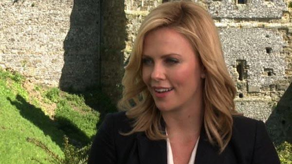 Charlize Theron talks to OnTheRedCarpet.com at a press junket for Snow White and the Huntsman outside of Arundel Castle in West Sussex in the United Kingdom in May 2012. - Provided courtesy of OTRC Charlize Theron talks to OnTheRedCarpet.com at a press junket for Snow White and the Huntsman outside of Arundel Castle in West Sussex in the United Kingdom in May 2012. - Provided courtesy of OTRC