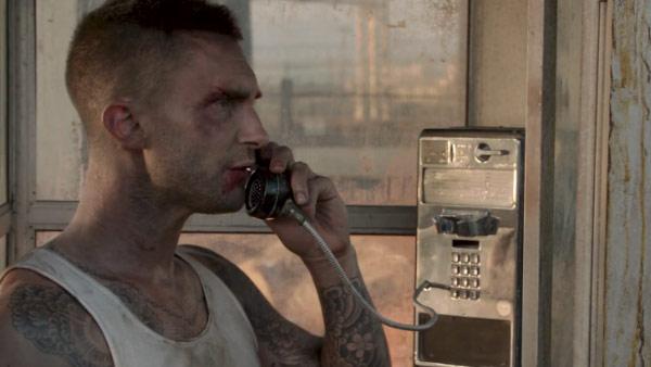 Adam Levine appears in a scene from his 2012 music video 'Payphone.'