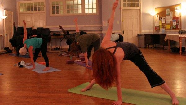 A photo of people doing yoga from December 2011.