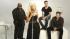 Adam Levine and the other judges appear in a...
