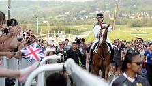 Zara Phillips, carries the Olympic Flame through Cheltenham Racecourse on her horse Toytown on May 23, 2012. - Provided courtesy of London Organising Committee of the Olympic and Paralympic Games