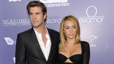 Liam Hemsworth, left, an honoree at the Australians in Film 8th Annual Breakthrough Awards, poses with his fiance Miley Cyrus on the red carpet in Los Angeles on Wednesday, June 27, 2012. - Provided courtesy of AP / AP Photo / Chris Pizzello