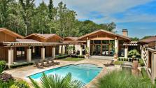 An exterior shot of Kenny Rogers former Polynesian-inspired lake house in Nicholson, Georgia. The singer had designed the 5-bedroom estate, which he once compared to Disneyland, and sold it on June 27, 2012 for $2.25 million. - Provided courtesy of GrandEstatesAuction.com