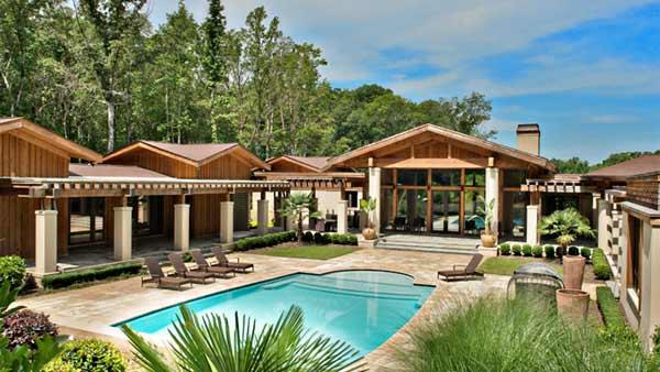 An exterior shot of Kenny Rogers former Polynesian-inspired lake house in Nicholson, Georgia. The singer had designed the 5-bedroom estate, which he once compared to Disneyland, and sold it on June 27, 2012 for $2.25 million. - Provided courtesy of GrandEstatesAuction.com An exterior shot of Kenny Rogers former Polynesian-inspired lake house in Nicholson, Georgia. The singer had designed the 5-bedroom estate, which he once compared to Disneyland, and sold it on June 27, 2012 for $2.25 million. - Provided courtesy of GrandEstatesAuction.com
