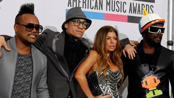 The Black Eyed Peas thank fans backstage at the 2010 American Music Awards in Los Angeles.
