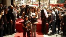 Slash poses with his wife and kids on his new Hollywood star on July 10, 2012. - Provided courtesy of OTRC