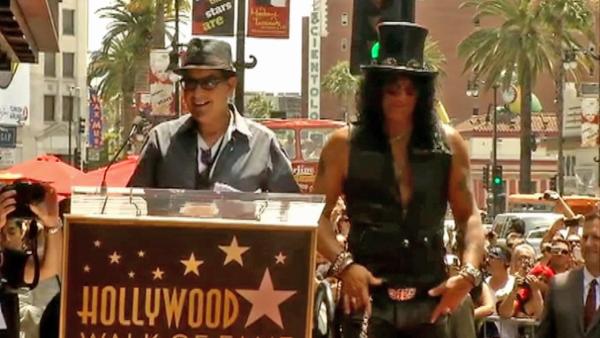 Slash appears with Charlie Sheen before receiving a star on the Hollywood Walk of Fame on July 10, 2012. - Provided courtesy of OTRC