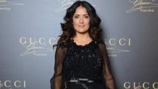 Salma Hayek wears a black chiffon, long-sleeved over-the-knee Gucci Fall-Winter 2012-13 dress with a beaded bodice and embroidered skirt to the Gucci Premiere fragrance launch event at Hotel Cipriani in Venice, Italy on Sept. 2, 2012. - Provided courtesy of Gucci