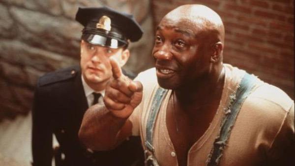 Michael Clarke Duncan (right) and Tom Hanks appear in a scene from the 1999 movie 'The Green Mile.'