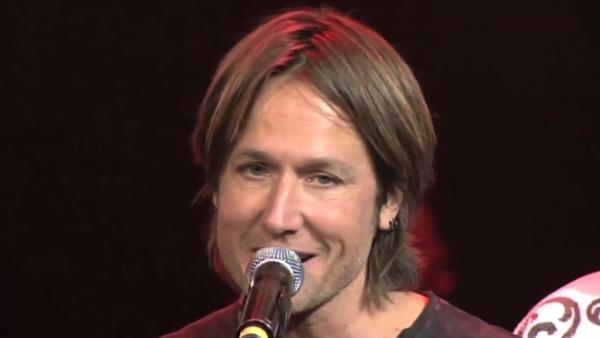 Keith Urban is surprised on stage at the 'All For The Hall' benefit concert at Bridgestone Arena on April 10, 2012 with a microphone stand symbolizing his invitation to join the Grand Ole Opry.