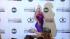 Christina Aguilera strikes sexy pose at AMA announcement Christina Aguilera poses for reporters after announcing the nominees of the 2012 American Music Awards on Oct. 9, 2012 in Los Angeles. - Provided courtesy of OTRC