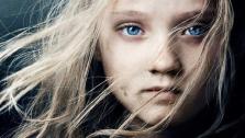 Isabelle Allen appears as young Cosette on the official poster for the 2012 film Les Miserables.