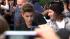 Justin Bieber poses with fans following a...