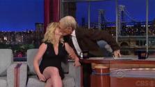 Dave Letterman kisses Amy Poehler on an episode of the CBS series The Late Show that aired on Nov. 20, 2012. - Provided courtesy of CBS / Worldwide Pants