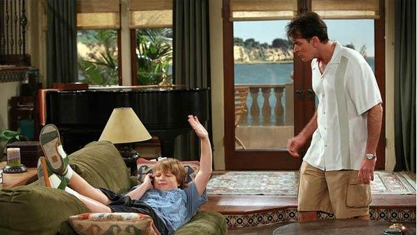 Charlie Sheen (right) and Angus T. Jones appear in a scene from the CBS show Two and a Half Men. - Provided courtesy of CBS / Warner Bros. Television