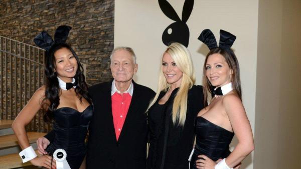 Hugh Hefner and Crystal Harris pose with Playboy Bunnies at the Beverly Hills City Council and Playboy Enterprises ribbon-cutting ceremony for Beverly Hills Playboy World Headquarters on Aug. 7, 2012.