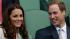 Britains Prince William, right, and Kate,...