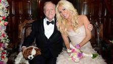 Hugh Hefner and Crystal Harris pose with their Cavalier King Charles Spaniel Charlie for an official wedding photo. The two tied the knot at the Playboy Mansion on Dec. 31, 2012 -- New Years Eve. - Provided courtesy of Elayne Lodge / Playboy Enterprises, Inc.